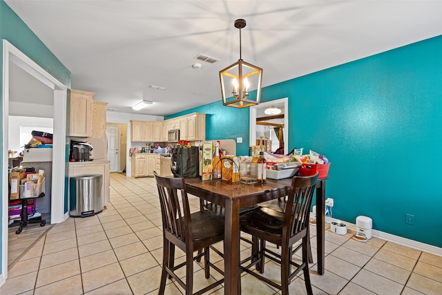 101 Remington Trl, Longview, TX 75604 - dining area featuring light tile patterned floors, baseboards, an inviting chandelier, and visible vents