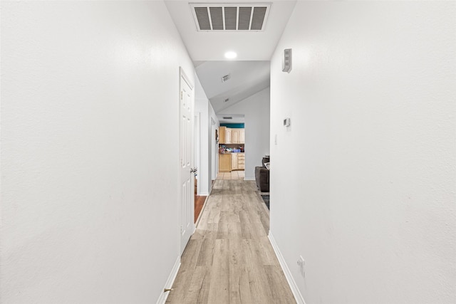 101 Remington Trl, Longview, TX 75604 - corridor featuring vaulted ceiling, light wood-type flooring, visible vents, and baseboards