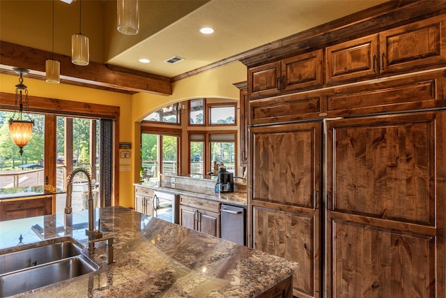 SQ13 Lake Cherokee, Henderson, TX 75652 - kitchen with french doors, dark stone countertops, a sink, visible vents, and decorative light fixtures