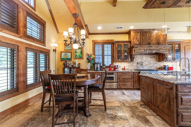 SQ13 Lake Cherokee, Henderson, TX 75652 - dining space featuring a wealth of natural light, a notable chandelier, baseboards, and visible vents