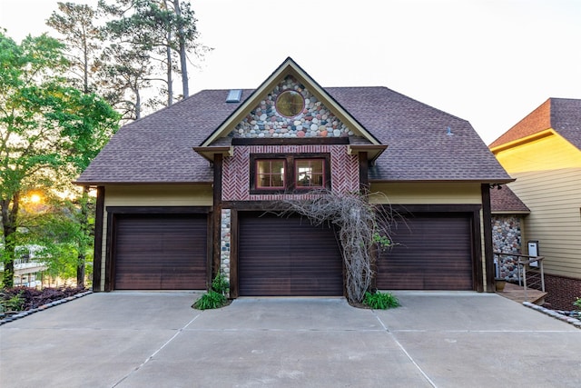 SQ13 Lake Cherokee, Henderson, TX 75652 - view of front of home featuring an attached garage, driveway, roof with shingles, and stone siding