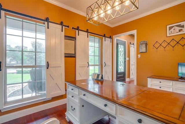 office with crown molding, dark wood-style flooring, and a barn door