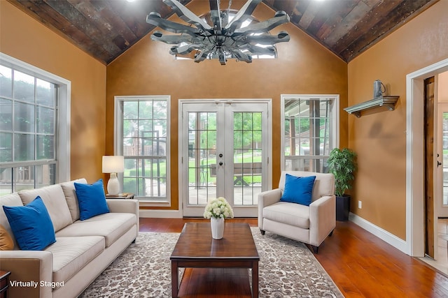 sunroom featuring a healthy amount of sunlight and french doors