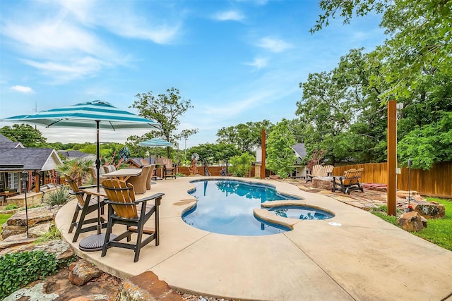 view of swimming pool with a patio, a fenced in pool, and a fenced backyard