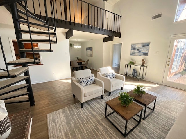 9434 Chimney Corner Ln, Dallas, TX 75243 - living area featuring baseboards, stairway, wood finished floors, and a towering ceiling