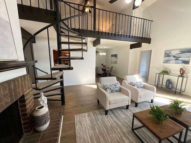 9434 Chimney Corner Ln, Dallas, TX 75243 - living area with baseboards, a brick fireplace, wood finished floors, stairway, and a high ceiling