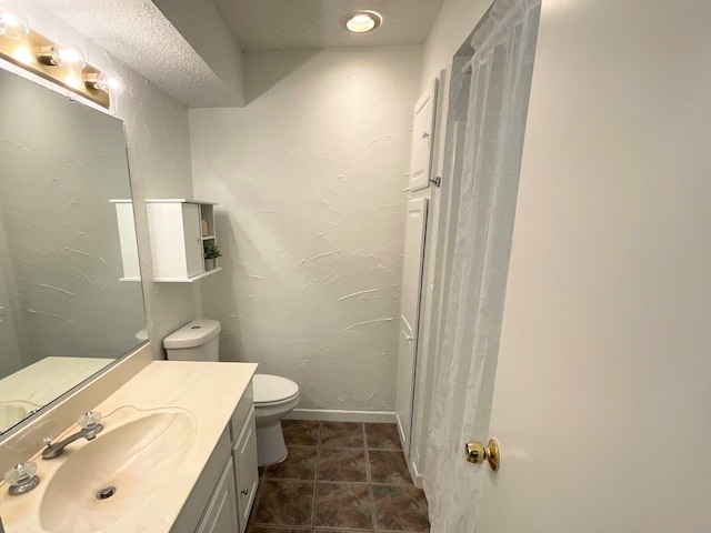 9434 Chimney Corner Ln, Dallas, TX 75243 - bathroom featuring vanity, toilet, and baseboards
