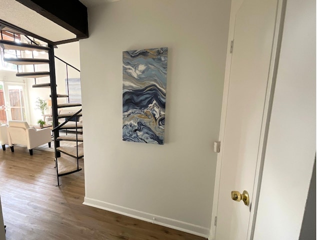 9434 Chimney Corner Ln, Dallas, TX 75243 - corridor featuring stairway, wood finished floors, and baseboards