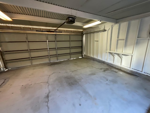 9434 Chimney Corner Ln, Dallas, TX 75243 - garage featuring a garage door opener