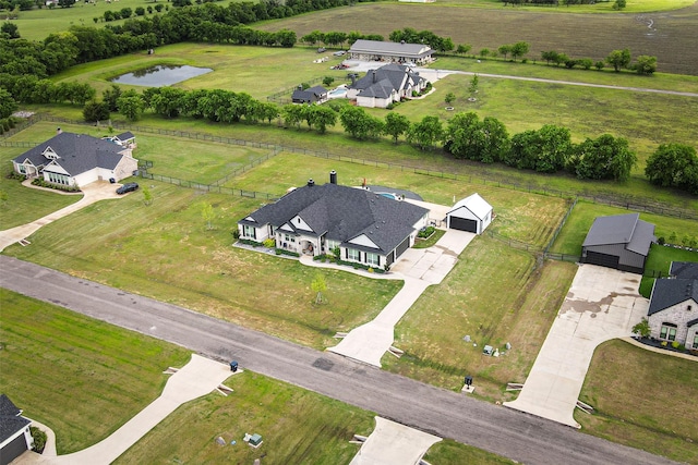 drone / aerial view with a water view and a rural view