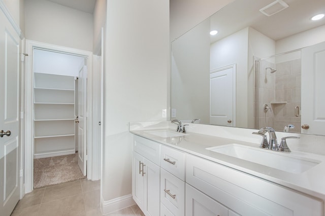 627 Rain Barrel Pl, Weston, TX 75009 - full bath featuring a tile shower, tile patterned flooring, double vanity, and a sink