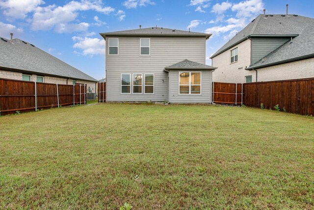 627 Rain Barrel Pl, Weston, TX 75009 - rear view of house featuring a lawn and a fenced backyard