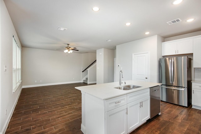 627 Rain Barrel Pl, Weston, TX 75009 - kitchen featuring a sink, dark wood-type flooring, baseboards, light countertops, and appliances with stainless steel finishes