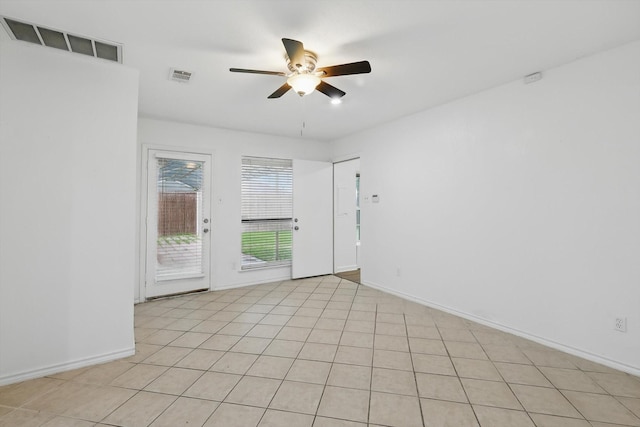 unfurnished room with visible vents, baseboards, and a ceiling fan