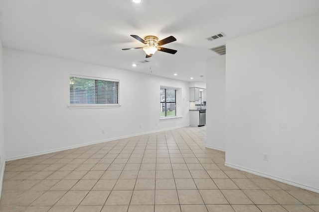unfurnished living room with light tile patterned flooring, visible vents, recessed lighting, ceiling fan, and baseboards