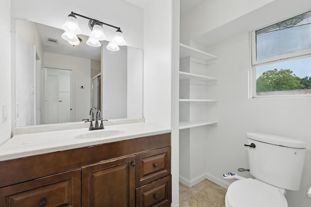 full bath with toilet, vanity, visible vents, tile patterned floors, and a stall shower