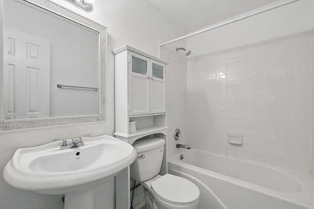 full bath featuring toilet, shower / bath combination, and a sink
