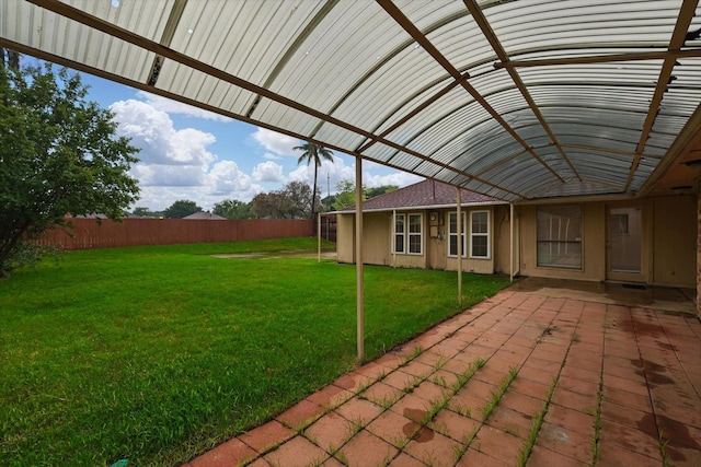 view of yard featuring fence and a patio