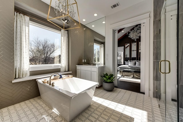 1725 Ranch House Rd, Celina, TX 75009 - full bath featuring a freestanding tub, a stall shower, vanity, and recessed lighting