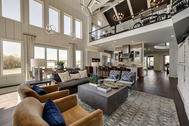 1725 Ranch House Rd, Celina, TX 75009 - living room featuring a high ceiling, dark wood finished floors, and a chandelier