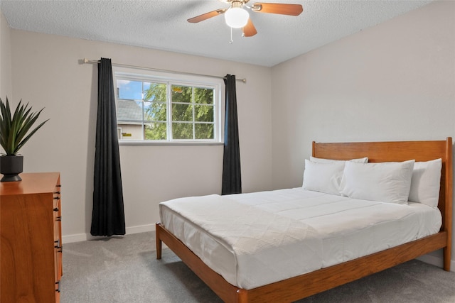 703 Trinidad Dr, Grand Prairie, TX 75052 - bedroom with carpet flooring, baseboards, a textured ceiling, and ceiling fan