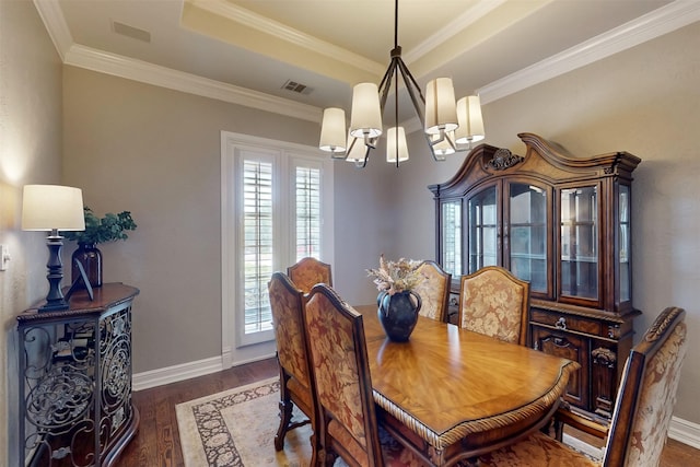 1908 Kings Pass, Heath, TX 75032 - dining space featuring wood finished floors, visible vents, baseboards, a chandelier, and ornamental molding