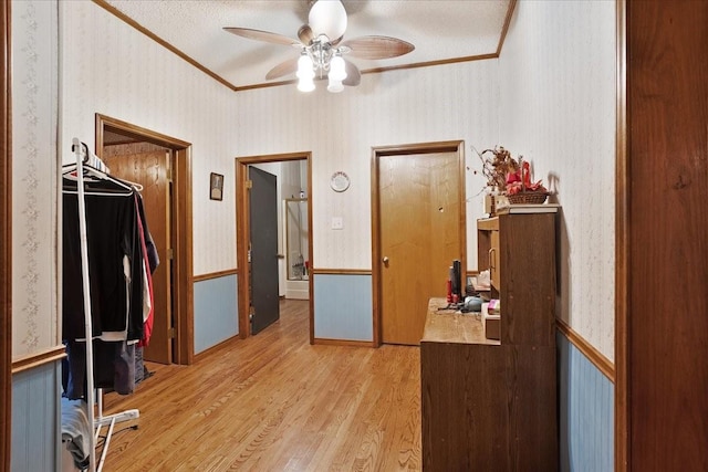 210 E Warren St, Wolfe City, TX 75496 - hall featuring crown molding, wallpapered walls, and light wood-style floors