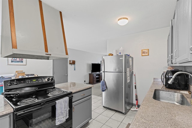 2405 Sweetwood Dr, Fort Worth, TX 76131 - kitchen with a sink, freestanding refrigerator, wall chimney exhaust hood, black electric range, and light countertops
