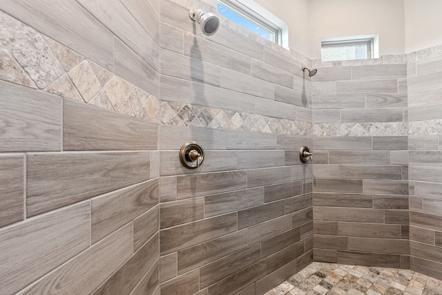 full bath with tiled shower