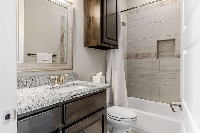 full bath featuring vanity, toilet, and shower / bath combo