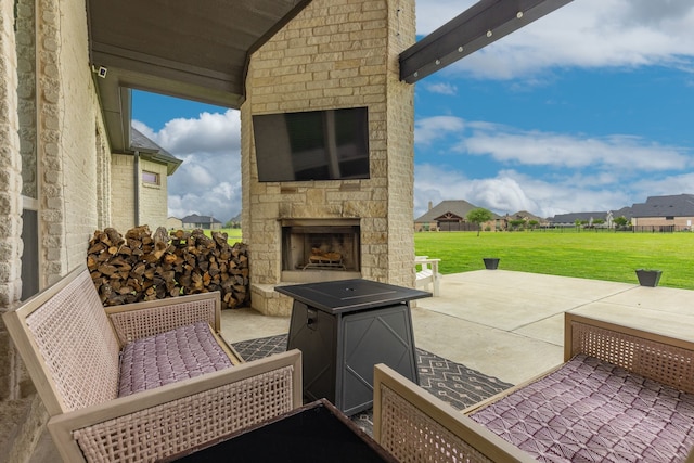 view of patio / terrace with an outdoor stone fireplace