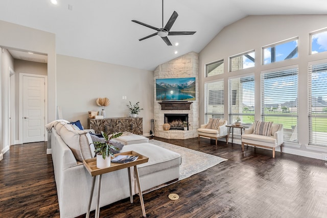 living room with wood finished floors, a ceiling fan, a stone fireplace, and recessed lighting
