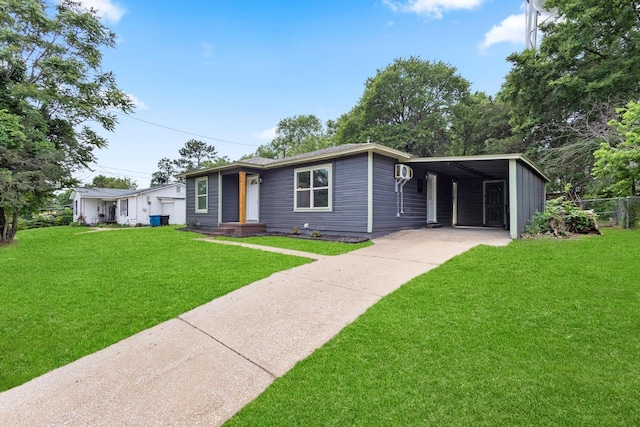 1417 S Lamar Ave, Denison, TX 75021 - ranch-style home featuring a front lawn, driveway, and fence