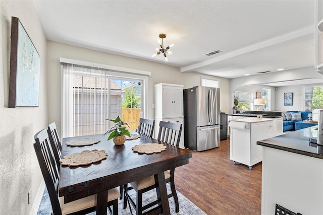 2512 Halloran St, Fort Worth, TX 76107 - dining area with a textured ceiling, visible vents, recessed lighting, dark wood-style flooring, and a notable chandelier
