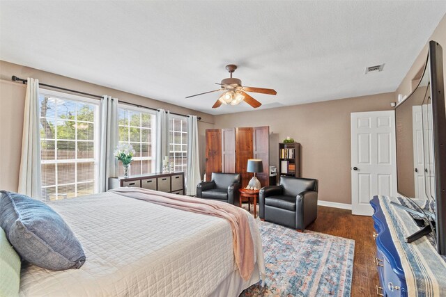 2512 Halloran St, Fort Worth, TX 76107 - bedroom featuring baseboards, a ceiling fan, visible vents, and dark wood finished floors