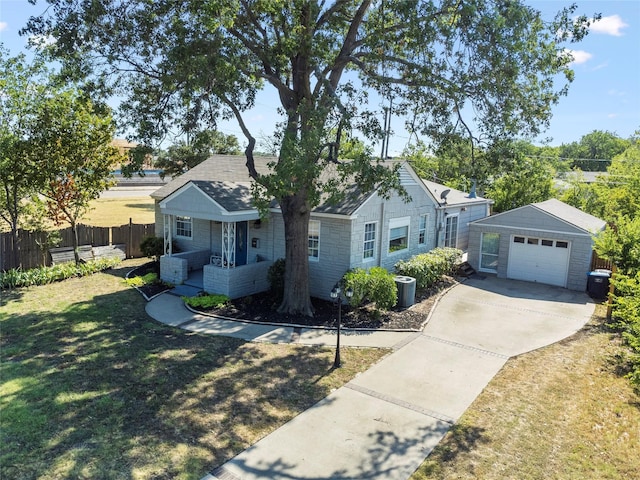 2512 Halloran St, Fort Worth, TX 76107 - view of front facade featuring fence, stone siding, concrete driveway, a garage, and a front yard