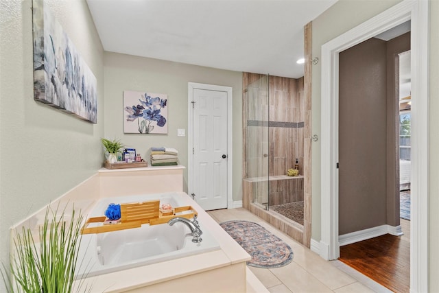 2512 Halloran St, Fort Worth, TX 76107 - full bathroom featuring tile patterned floors, a bath, baseboards, a shower stall, and recessed lighting
