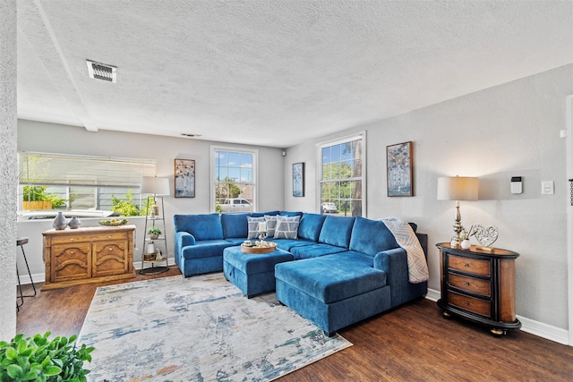 2512 Halloran St, Fort Worth, TX 76107 - living room featuring a textured ceiling, visible vents, wood finished floors, and baseboards