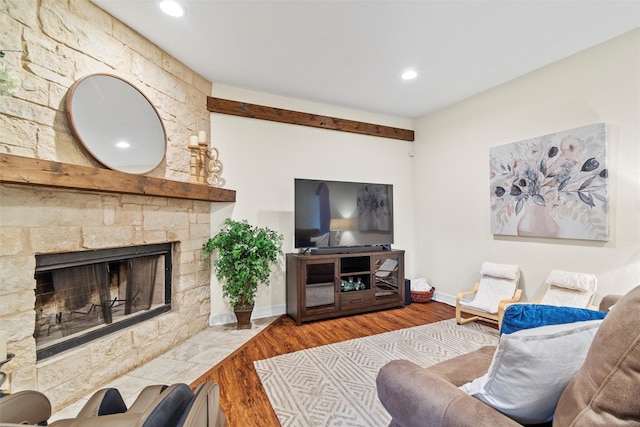 2512 Halloran St, Fort Worth, TX 76107 - living room featuring baseboards, a stone fireplace, recessed lighting, and wood finished floors