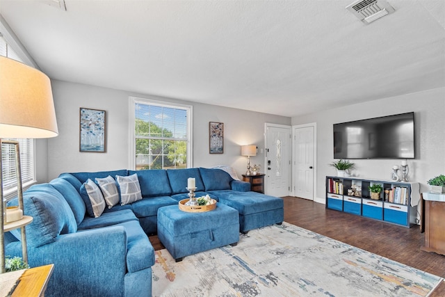 2512 Halloran St, Fort Worth, TX 76107 - living room with visible vents, wood finished floors, and baseboards