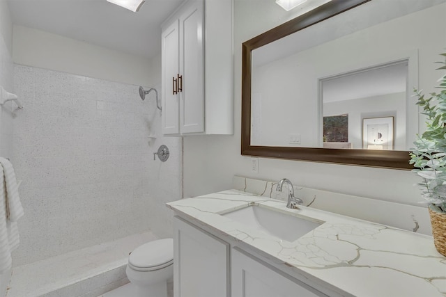 5229 Cockrell Ave, Fort Worth, TX 76133 - full bathroom featuring a tile shower, vanity, and toilet