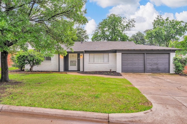 5229 Cockrell Ave, Fort Worth, TX 76133 - view of front facade featuring an attached garage, driveway, a front lawn, and brick siding