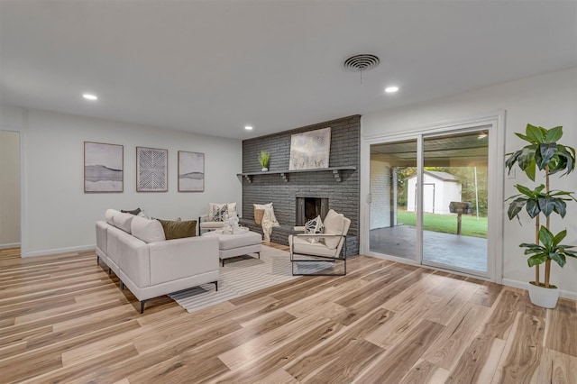 5229 Cockrell Ave, Fort Worth, TX 76133 - living room with light wood-style floors, recessed lighting, baseboards, and a brick fireplace