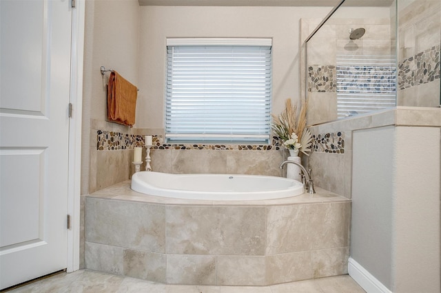 full bathroom featuring walk in shower, a bath, and tile patterned floors