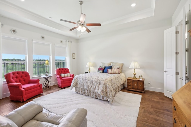 846 Cordoba Ln, Rockwall, TX 75087 - bedroom featuring a raised ceiling, dark wood-style flooring, baseboards, recessed lighting, and ceiling fan