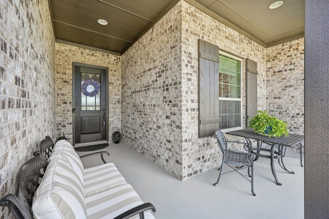 846 Cordoba Ln, Rockwall, TX 75087 - property entrance featuring a porch and brick siding