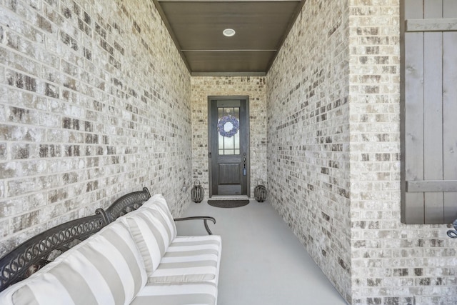 846 Cordoba Ln, Rockwall, TX 75087 - view of exterior entry featuring brick siding and a porch