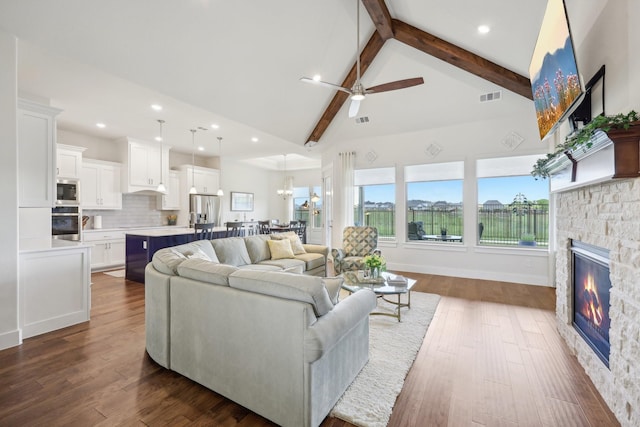 846 Cordoba Ln, Rockwall, TX 75087 - living area with beamed ceiling, a fireplace, high vaulted ceiling, ceiling fan, and dark wood-style flooring