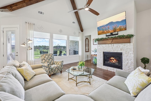 846 Cordoba Ln, Rockwall, TX 75087 - living room with ceiling fan, a stone fireplace, plenty of natural light, and wood finished floors