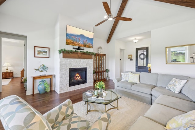 846 Cordoba Ln, Rockwall, TX 75087 - living room with wood finished floors, a ceiling fan, a stone fireplace, and baseboards